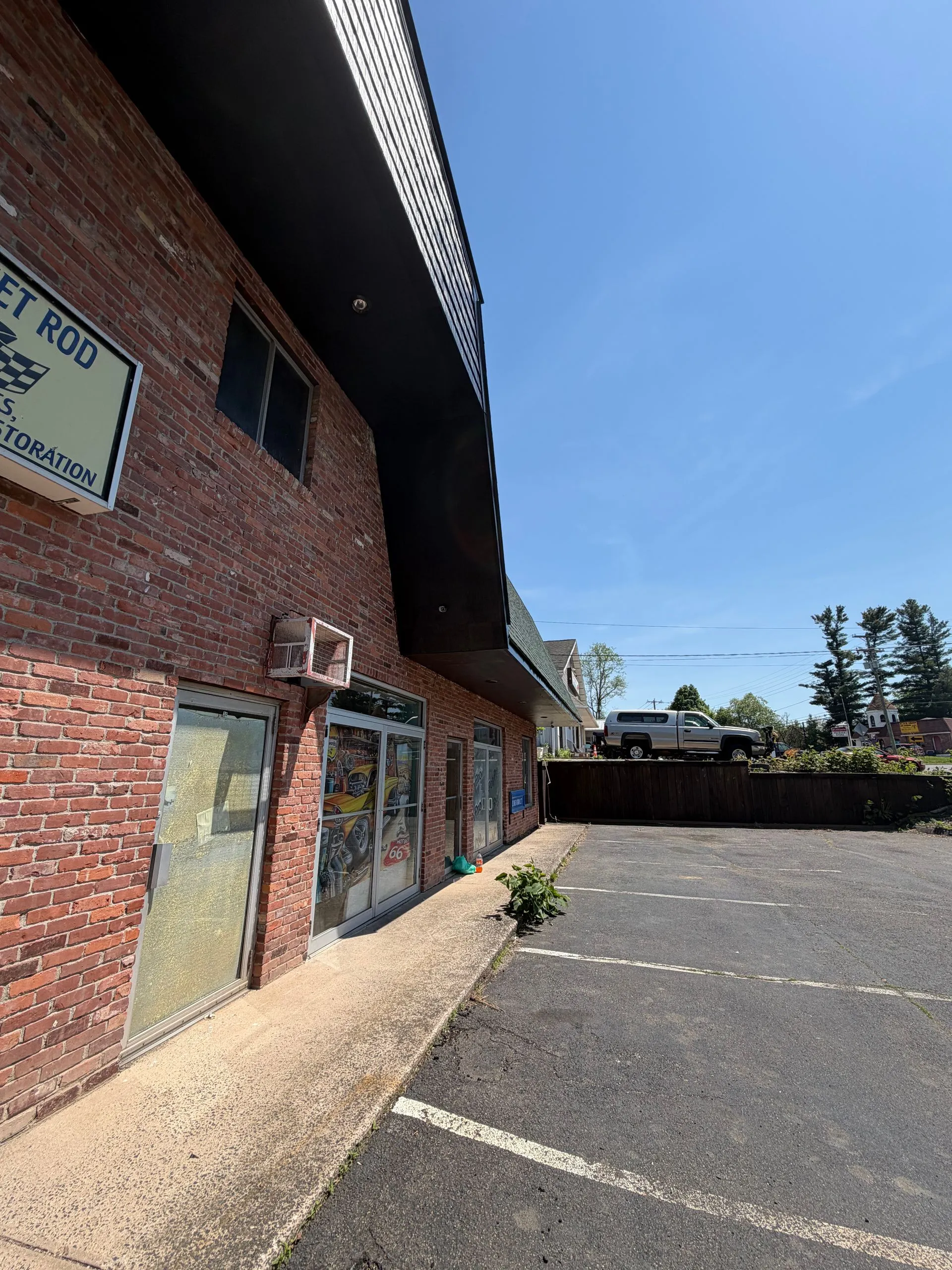 Brick commercial building black fascia after painting