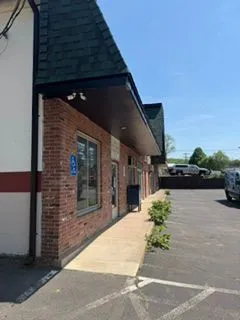 Brick commercial plaza black trim walkway after painting