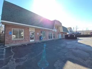 Brick commercial plaza exterior before painting