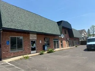 Brick commercial plaza green roof after painting