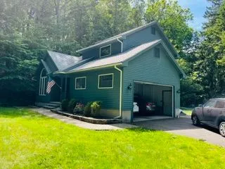 Green house garage side after exterior painting