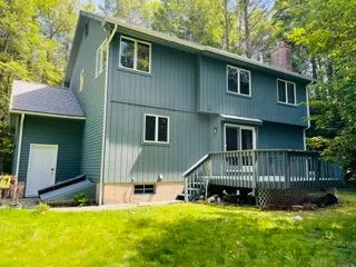Green house rear deck after exterior painting