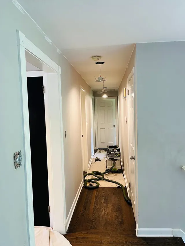 Hallway light blue walls painting in progress