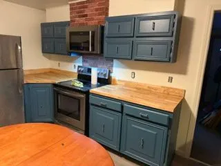 Kitchen cabinets painted blue range wall