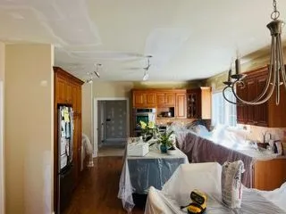 Kitchen ceiling patching cabinets covered before painting