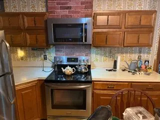 Kitchen oak cabinets range wall before cabinet painting