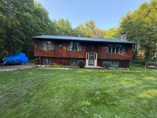 Raised ranch wood siding front after staining