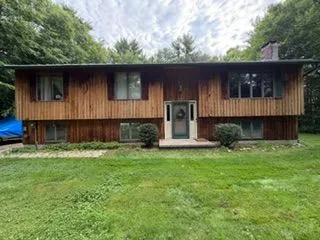 Raised ranch wood siding front before staining