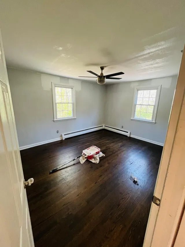 Repainted bedroom gray walls dark hardwood floor
