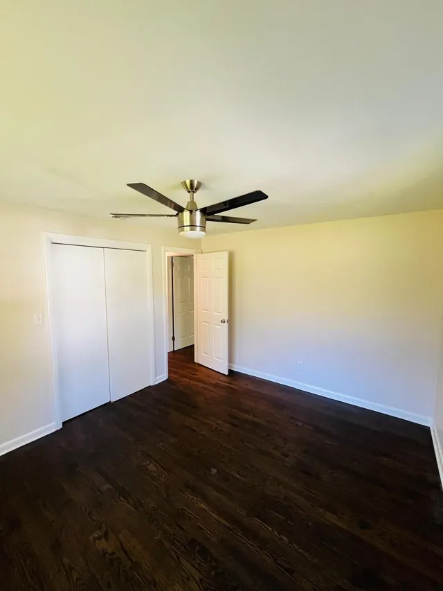 Repainted bedroom white walls closet ceiling fan