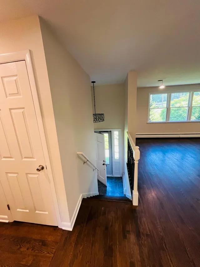 Repainted entry hallway white walls and doors