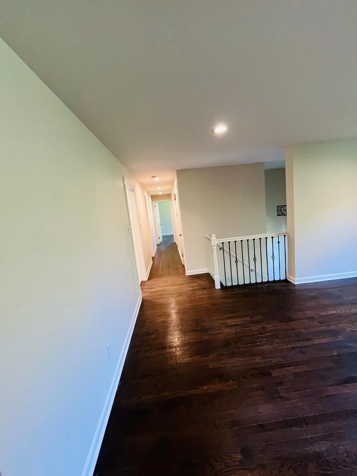 Repainted upstairs hallway white walls recessed lights