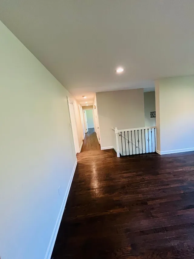 Repainted upstairs hallway white walls recessed lights