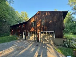 Stained wood house garage side after staining