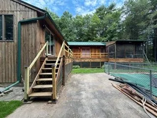 Wood sided house new deck stairs before staining